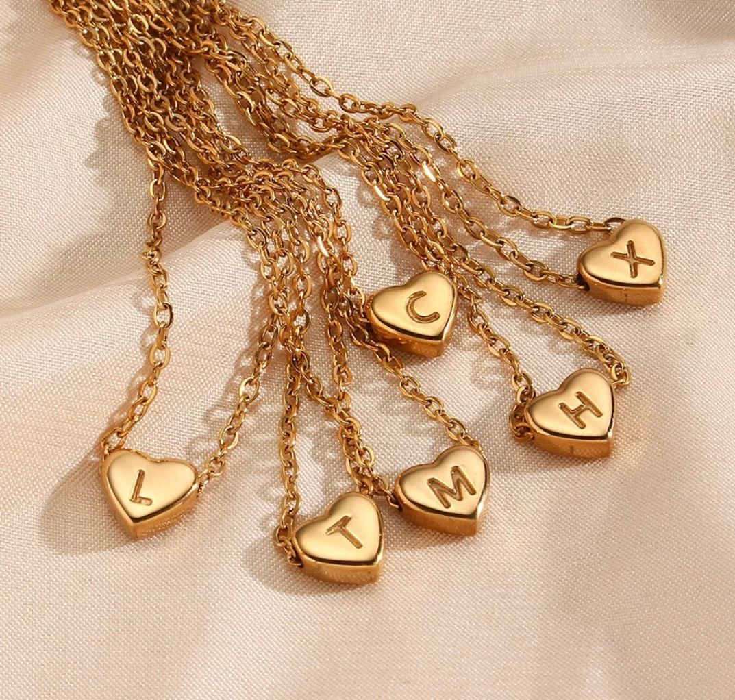 L, T, M, C, H and X letter gold medallions